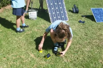 A student connects a solar panel as part of an energy activity at a CERES excursion about climate change