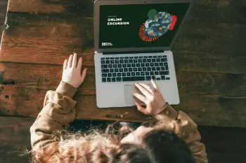 Person using a laptop with CERES "online excursions" written on their screen